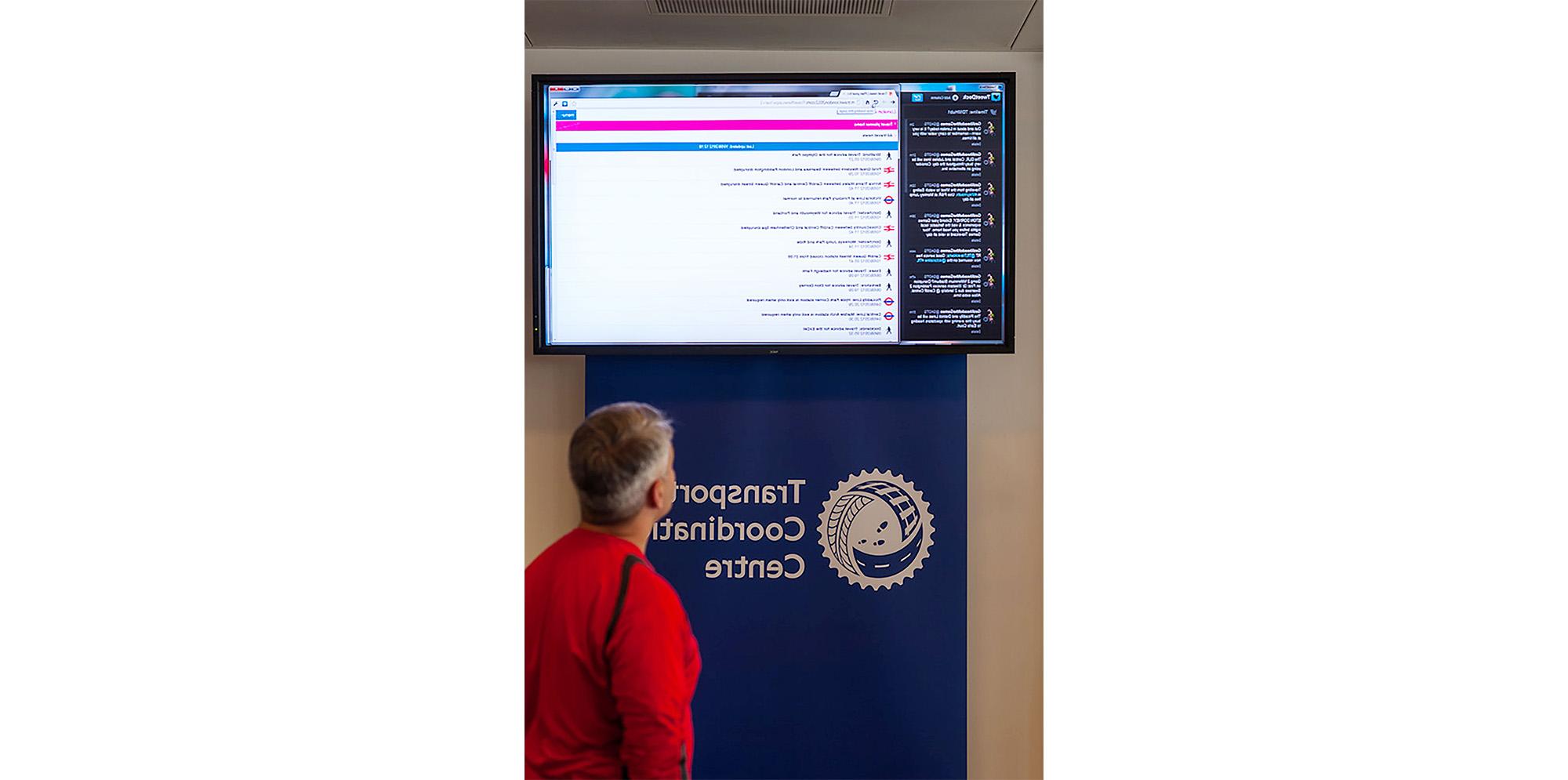 Person looking at TV at the Transportation Coordination Centre